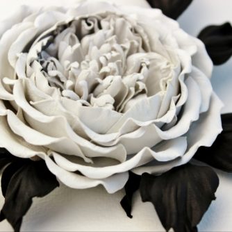 white leather rose brooch