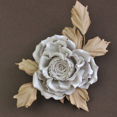 white and beige leather rose