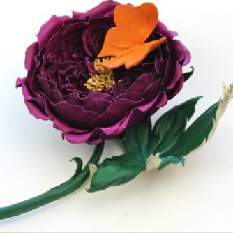 Leather English rose corsage with a butterfly