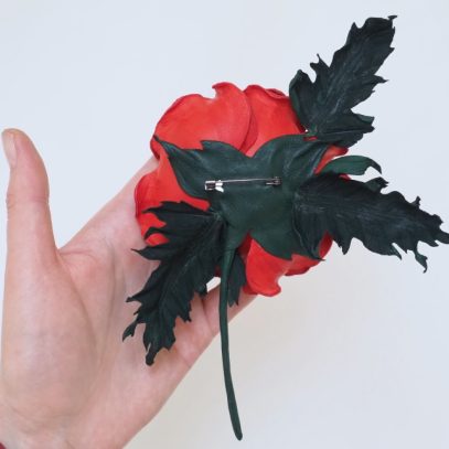 red leather poppy corsage back