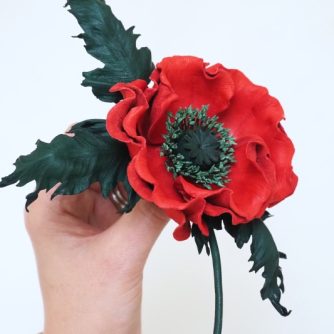 red leather poppy corsage side