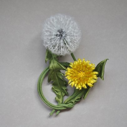 silk dandelion clock with a flower brooch