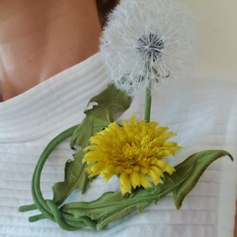 silk dandelion clock with a flower brooch