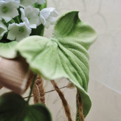 lily of the valley buttonhole detail
