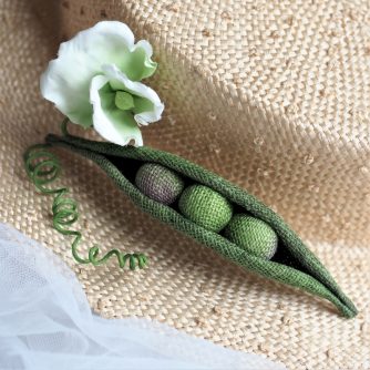 linen pea pod brooch hat