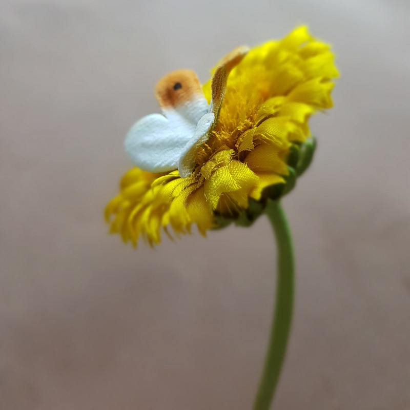 silk dandelion flower and clock corsage detail