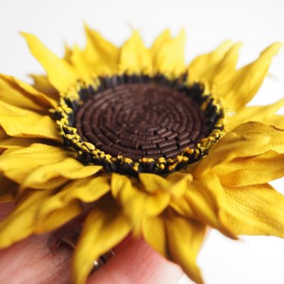 leather sunflower pin side