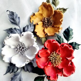 leather wild rose brooches