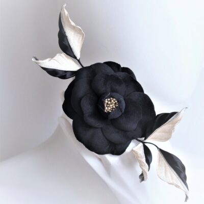 black and golden camellia corsage