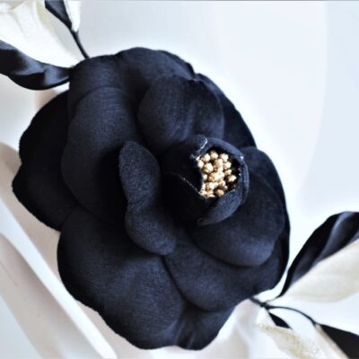 black and golden camellia corsage closeup