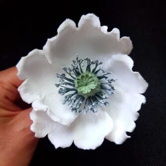white poppy corsage closeup