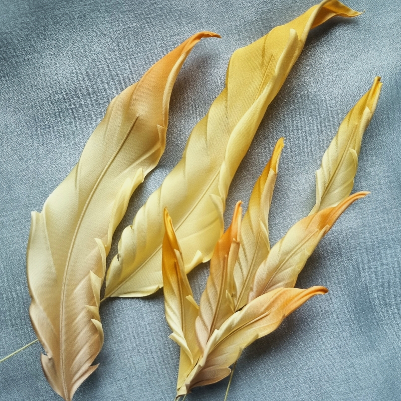 stylised yellow fabric feathers