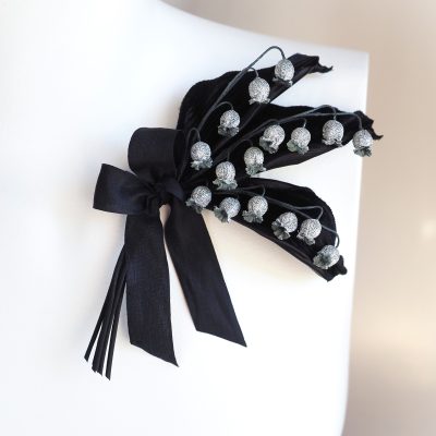 silver and black lily of the valley corsage