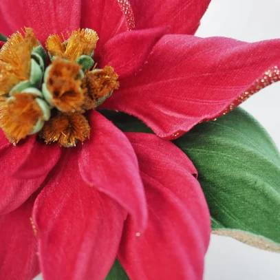 red velvet poinsettia brooch closeup